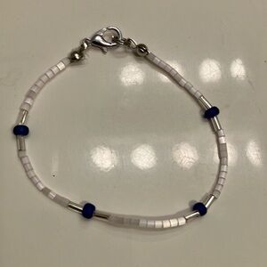 Tiny pink glass beads with silver and blue iridescent beads 6 1/2” bracelet. ￼